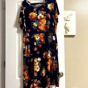 Navy blue floral dress, with red, orange, yellow, and blue flowers.